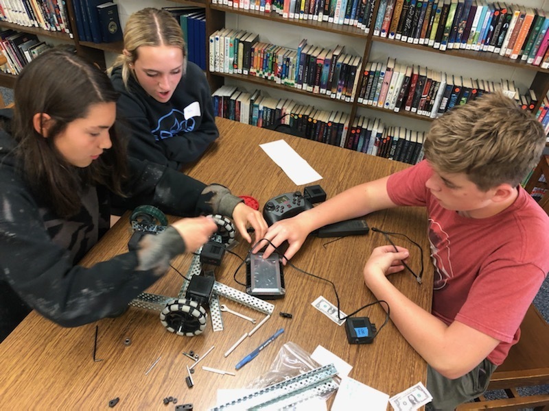 HAL students working together to build a robot